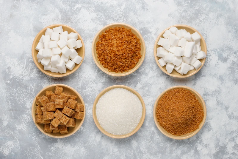 2 various-types-sugar-brown-sugar-white-concrete-top-view
